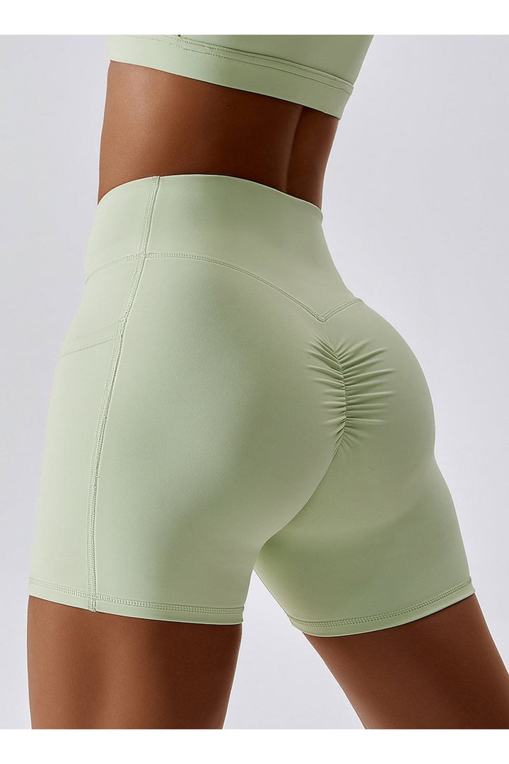 Ruched Pocketed High Waist Active Shorts - Short Leggings - FITGGINS